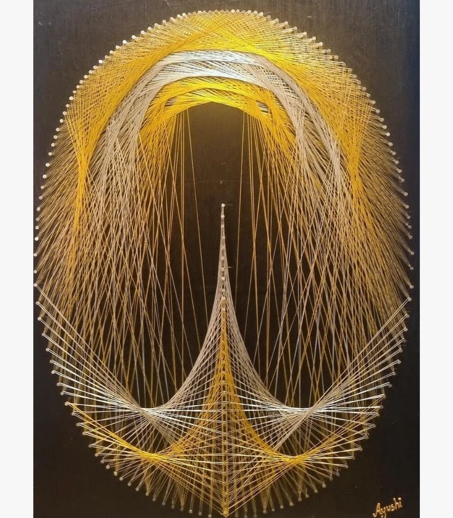 asit-trivedi-golden-luminescence-string-art Contemporary geometric string art on a dark wooden board titled Golden Luminescence by Asit Trivedi featuring intricate yellow, gold, and white threads woven across metallic nails to form a complex oval and architectural spire composition.
