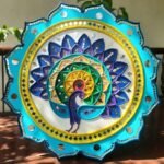 Handcrafted white and black Lippan art 9-piece grid frame set featuring peacock motifs, geometric mandalas, and mirror work by artist Rucha Desai.