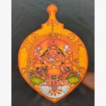 Traditional Kerala mural painting titled Goddess Bhagavathy by Akshaya Sivadas featuring a detailed portrait of the four-armed deity seated enthroned on a shaped wooden board.