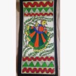 An original Indian Madhubani folk art painting on handmade paper featuring a colorful peacock among green foliage by artist Bhavna Mishra.