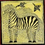 An original Indian Madhubani folk art pen and ink painting on yellow handmade paper depicting a zebra framed by leaf motifs and birds in flight by artist Dr. Pratibha Jain.
