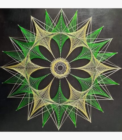 Handcrafted geometric string art mandala on a dark wooden board titled Emerald Mandala by Asit Trivedi featuring intricate green, yellow, and white threads forming a multi-layered starburst and floral wheel pattern.