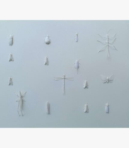 A minimalist monochromatic white mixed media paper relief sculpture featuring an assortment of meticulously detailed insect figures mounted across a textured pale off-white background by Hardev Chauhan.
