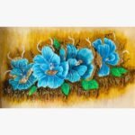 Handcrafted 3D clay relief mural titled Turquoise Blossom Harmony by Sabana Munshi featuring textured vibrant blue hibiscus flowers with metallic gold borders and green leaves on an ochre background.