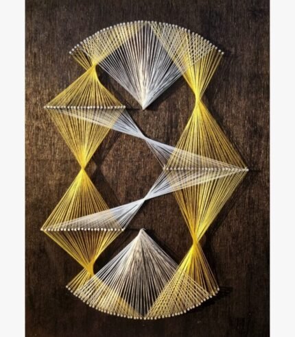 Modern abstract geometric string art on a dark textured wood board titled Kinetic Helix by Asit Trivedi featuring interwoven golden yellow and white threads forming complex diamond and hourglass tension patterns.