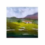 An original impressionistic watercolor landscape painting on paper depicting a white terracotta-roofed cottage nestled in a sunlit green field under misty purple mountains by artist Avinash.