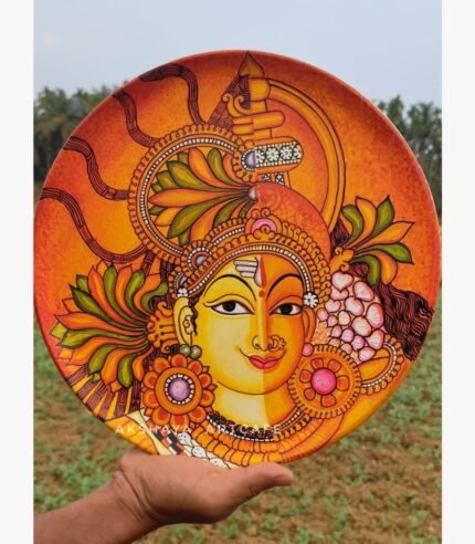 Hand-painted decorative wall plate titled Ardhanarishvara Harmony by Akshaya Sivadas featuring a traditional Kerala mural portrait of Lord Shiva and Goddess Parvati split vertically on a circular terracotta base.