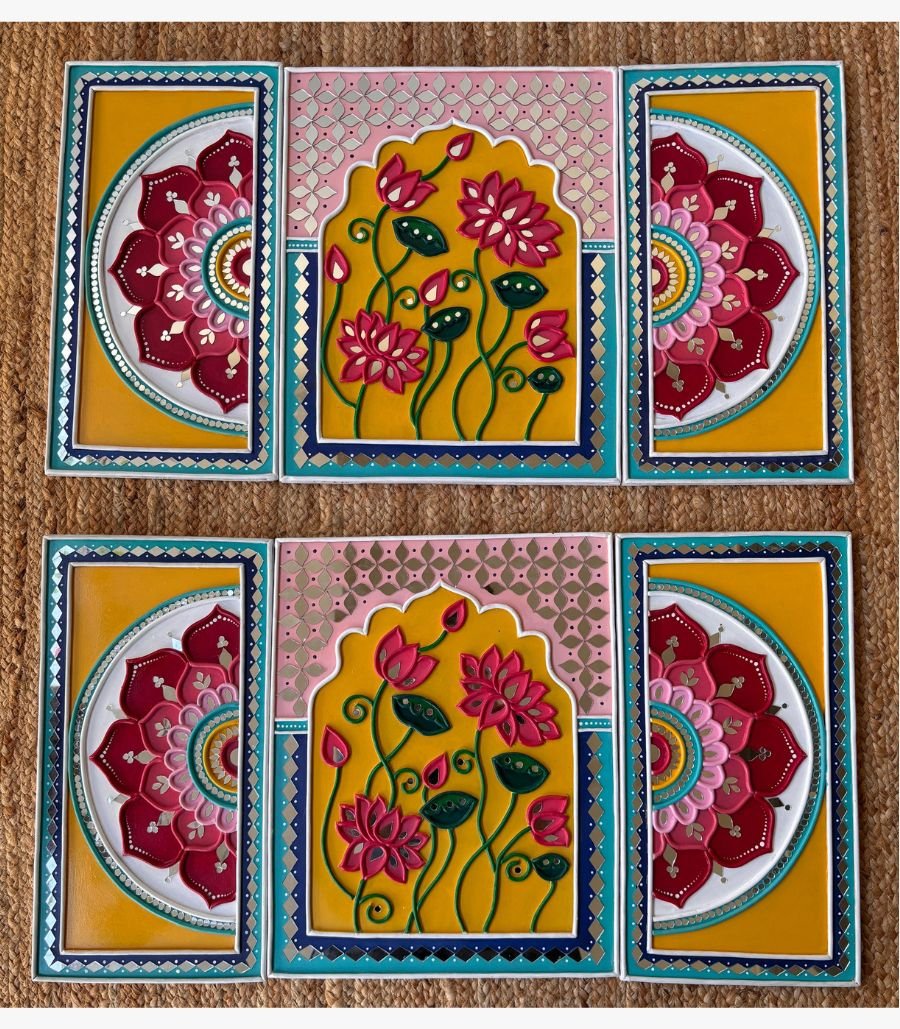 8 Handcrafted pair of blooming lotus arch Lippan art triptych sets featuring vibrant yellow and pink mud relief with mirror work by artist Rucha Desai.