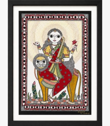 A traditional Madhubani painting on handmade paper depicting four-armed Goddess Katyayani in red and green attire holding a golden curved sword and lotus while seated on a lion mount, framed by a protective eye-pattern border by artist Anupriya.