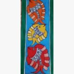 An original Indian Madhubani folk art painting on handmade paper featuring three colorful fish in orange, yellow, and red swimming against a blue background by artist Bhavna Mishra.