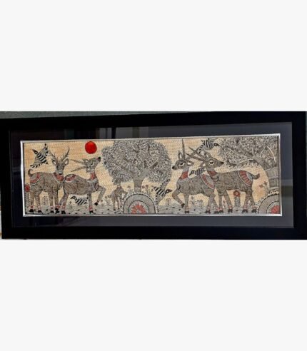An original Indian Madhubani folk art painting on handmade paper featuring a herd of horned deer in a forest under a red sun by artist Bhavna Mishra.