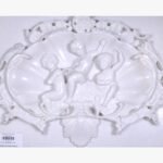 Hand-carved white marble relief sculpture titled Three Boys by Mangalya Stone Panels depicting three cherubs inside a decorative baroque shell frame.
