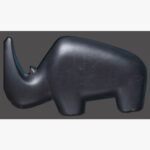 Hand-carved black stone minimalist rhinoceros sculpture titled Minimalist Rhinoceros by Mangalya Stone Panels showing a smooth, modern abstract wildlife figurine with clean contours.