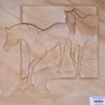 Hand-carved Khatu beige sandstone relief stone panel titled Two Horse Khatu by Mangalya Stone Panels showcasing two running horses chiseled inside a recessed rectangular frame.