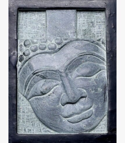 A hand-carved stone relief plaque of a serene Buddha face with closed eyes, set within a rustic dark metal frame, perfect for zen wall decor and meditation rooms.