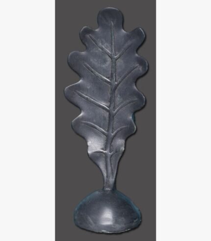 A hand-forged dark metal sculpture of an oak leaf with detailed veins rising from a solid rounded dome base, isolated against a neutral background.