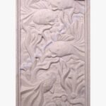 Hand-carved Dhrangadhra beige sandstone vertical relief panel titled Fish Panel by Mangalya Stone Panels featuring swimming fish amidst detailed coral reefs and aquatic sea anemones.