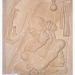 Hand-carved Khatu beige sandstone vertical relief panel titled Old Barbar by Mangalya Stone Panels portraying a traditional folk figure engaged in a classical shaving ritual.