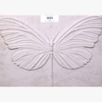 Hand-carved Gwalior white sandstone horizontal relief panel titled Butterfly by Mangalya Stone Panels showcasing a detailed lepidoptera silhouette with deeply chiseled wing veins.