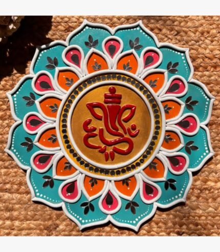 Handcrafted circular Lord Ganesha Lippan art wall hanging with teal and orange lotus petals, mirror work, and central gold motif by Rucha Desai.