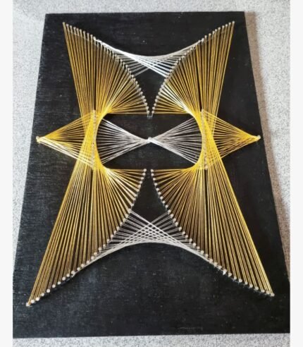 Handcrafted 3D geometric string art featuring gold and silver thread starburst and hour-glass matrix on a dark wooden board by Art Impression.