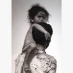Original charcoal artwork titled The Weight He Carries by Ashish Panasa featuring a child clinging to their father's shoulders.