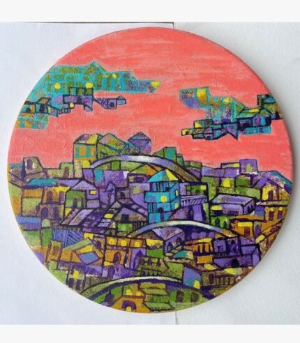 Circular acrylic canvas painting titled The Warmth of Cityscape by Payal Dubey depicting stylized buildings under a warm pink sky.